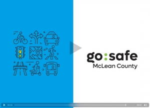 video screen with an assortment of transportation themed icons on a bright blue background, and the Go:Safe logo on the right.
